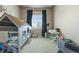 Playful bedroom includes a unique playhouse bed frame and ample room for activities at 756 Ranchhand Dr, Berthoud, CO 80513