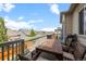 This deck features a wooden table and chairs, perfect for relaxing and entertaining outdoors at 756 Ranchhand Dr, Berthoud, CO 80513