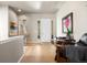 Bright entryway with hardwood floors, stylish decor, and a clear view of the front door and living spaces at 756 Ranchhand Dr, Berthoud, CO 80513