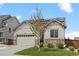 Charming home with a stone and siding exterior, solar panels, an attached garage, and a well-manicured lawn at 756 Ranchhand Dr, Berthoud, CO 80513