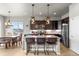 Kitchen featuring granite counters, stainless steel appliances and island with bar stool seating at 756 Ranchhand Dr, Berthoud, CO 80513