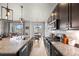 Open concept kitchen and dining area with a kitchen island and granite countertops at 756 Ranchhand Dr, Berthoud, CO 80513