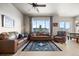Inviting living room with a large window providing natural light and hardwood floors at 756 Ranchhand Dr, Berthoud, CO 80513