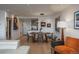 Modern dining area with hardwood floors and kitchen access at 800 N Pearl St # 1201, Denver, CO 80203