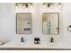 Bright bathroom featuring dual sinks with sleek faucets, modern mirrors, and modern sconce lighting at 3866 S King St, Denver, CO 80236