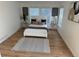Bedroom includes a white bed, bedside tables, neutral decor, and a large window with natural light at 3866 S King St, Denver, CO 80236