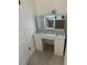 Chic vanity area featuring a white desk with crystal knobs and a lighted makeup mirror at 3866 S King St, Denver, CO 80236