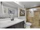 Well-lit bathroom featuring a framed mirror, walk-in shower, and tasteful decor for a clean and modern look at 61 S 17Th Ave Dr, Brighton, CO 80601