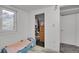 Cozy bedroom with wood floors, a patterned rug, and a window for natural light, creating a relaxing atmosphere at 61 S 17Th Ave Dr, Brighton, CO 80601