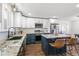 Modern kitchen with granite island, stainless steel appliances, and custom cabinetry at 1964 S Leyden St, Denver, CO 80224