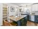 Modern kitchen with granite island, stainless steel appliances, and custom cabinetry at 1964 S Leyden St, Denver, CO 80224