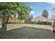 Large backyard with trees and wooden fence at 19954 E Dartmouth Ave, Aurora, CO 80013