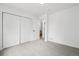 Bedroom features closet, light grey walls and plush carpeting throughout at 19954 E Dartmouth Ave, Aurora, CO 80013