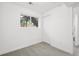 Bright bedroom with a large window and neutral carpet at 19954 E Dartmouth Ave, Aurora, CO 80013
