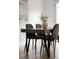 Modern dining room with a wooden table, stylish chairs, and contemporary decor at 19954 E Dartmouth Ave, Aurora, CO 80013