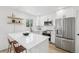 Modern kitchen with stainless steel appliances and white countertops at 19954 E Dartmouth Ave, Aurora, CO 80013