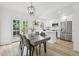 Bright kitchen featuring stainless steel appliances, an island, and a dining area at 19954 E Dartmouth Ave, Aurora, CO 80013