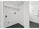 Laundry room with black marble tile floor and white walls at 19954 E Dartmouth Ave, Aurora, CO 80013