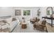 Bright living room with modern furniture, large windows, and stylish decor, creating a cozy and inviting atmosphere at 19954 E Dartmouth Ave, Aurora, CO 80013