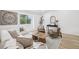 Tastefully decorated living room with stylish seating, natural light, and minimalist decor, perfect for relaxation at 19954 E Dartmouth Ave, Aurora, CO 80013