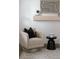 Seating area showcasing a comfortable armchair, side table, and contemporary decor at 19954 E Dartmouth Ave, Aurora, CO 80013