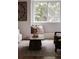 Close-up of a stylish living room, highlighting natural light, chic decor, and cozy seating arrangements at 19954 E Dartmouth Ave, Aurora, CO 80013