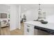 Bright living space with seamless flow between kitchen, dining, and living areas at 19954 E Dartmouth Ave, Aurora, CO 80013