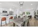 Open-concept living space with kitchen, dining, and living areas flowing together at 19954 E Dartmouth Ave, Aurora, CO 80013