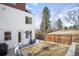 Landscaped backyard with a patio, seating area, and privacy fence at 2600 S Sherman St, Denver, CO 80210