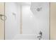 Modern bathroom with tile surround, shower head, and sleek fixtures at 2600 S Sherman St, Denver, CO 80210