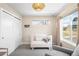 Cozy bedroom features neutral tones, lots of natural light, and comfortable seating at 2600 S Sherman St, Denver, CO 80210