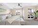 Bright bedroom with neutral tones, plush carpet, and access to a balcony with views at 2600 S Sherman St, Denver, CO 80210