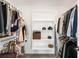 Walk-in closet with hanging racks, shelving, and storage solutions to maximize organization at 2600 S Sherman St, Denver, CO 80210