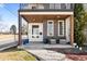 Inviting front porch with seating, modern accents, and well-maintained landscaping at 2600 S Sherman St, Denver, CO 80210