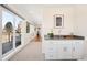 Living room with large windows and a bar, showcasing an open layout at 2600 S Sherman St, Denver, CO 80210