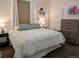 Cozy bedroom with neutral tones and a comfortable bed for restful nights at 3357 N Akron Ct, Denver, CO 80238