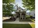 Charming home featuring a stone-accented porch, landscaped front yard, and a welcoming entrance at 3357 N Akron Ct, Denver, CO 80238