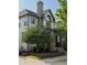 Two story home with stone accents, well-maintained front yard, and charming architectural details at 3357 N Akron Ct, Denver, CO 80238