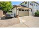Attached garage with a car parked in the driveway at 3357 N Akron Ct, Denver, CO 80238