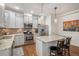 Modern kitchen with stainless steel appliances, granite countertops, and a stylish island at 3357 N Akron Ct, Denver, CO 80238