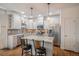 Elegant kitchen with modern appliances, granite countertops, and a breakfast bar at 3357 N Akron Ct, Denver, CO 80238