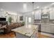 Bright kitchen featuring a center island, granite countertops, and stainless steel appliances at 3357 N Akron Ct, Denver, CO 80238