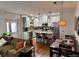 Inviting living room flows into a modern kitchen, perfect for entertaining guests at 3357 N Akron Ct, Denver, CO 80238