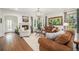 Cozy living room with a fireplace, hardwood floors, and comfortable seating with decor at 3357 N Akron Ct, Denver, CO 80238