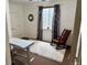 Bright room features a comfortable rocking chair next to a sunny window at 3357 N Akron Ct, Denver, CO 80238