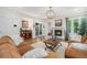 Comfortable living room with a fireplace, stylish decor, and an open layout to the adjacent rooms at 3357 N Akron Ct, Denver, CO 80238