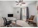 Bright office space features a modern desk, comfortable chair, and window with natural light at 3357 N Akron Ct, Denver, CO 80238