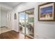 Inviting covered patio with comfortable wicker furniture, accessible through sliding glass doors at 3357 N Akron Ct, Denver, CO 80238