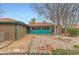 View of backyard featuring rock landscaping and wooden fence at 8511 Essex Dr, Denver, CO 80229