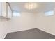 Basement showcases clean, bright space with recessed lighting and windows for natural light at 8511 Essex Dr, Denver, CO 80229